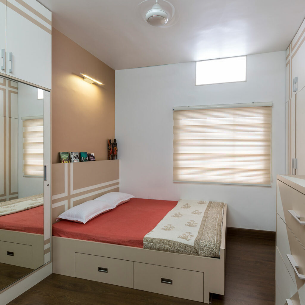 A mirrored bedroom wardrobe with a window and photo frames which includes bedroom wardrobe designs photos