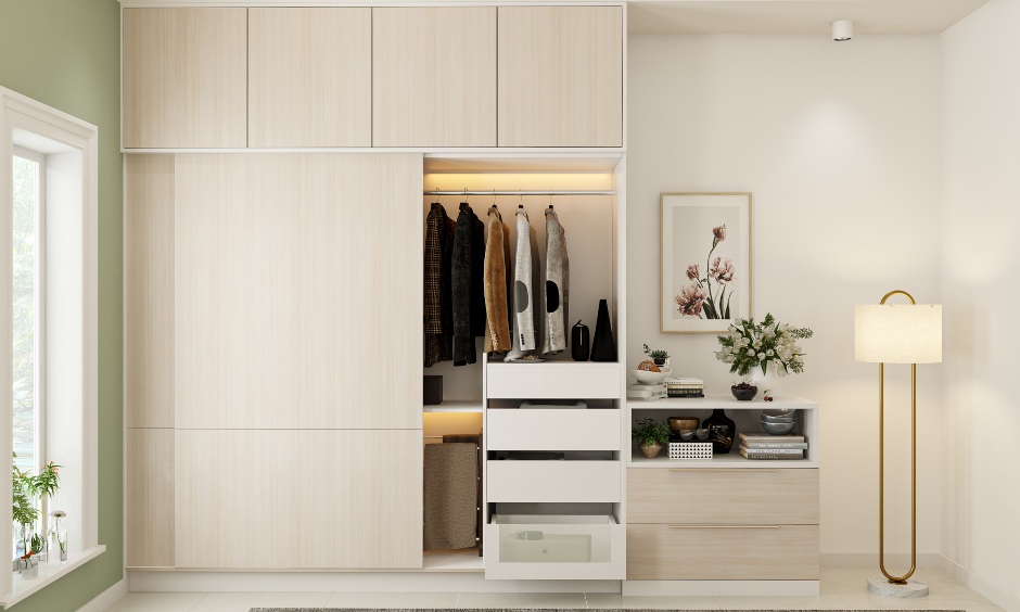 Sleek sliding wardrobe design with an in built trouser rack