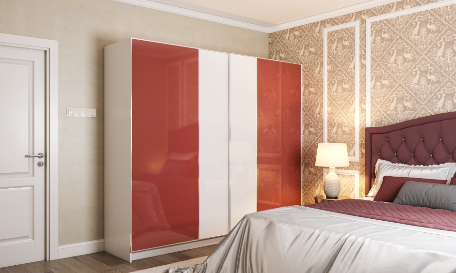 A Red And White Sliding Door Wardrobe With A Laminate Finish - DesignCafe