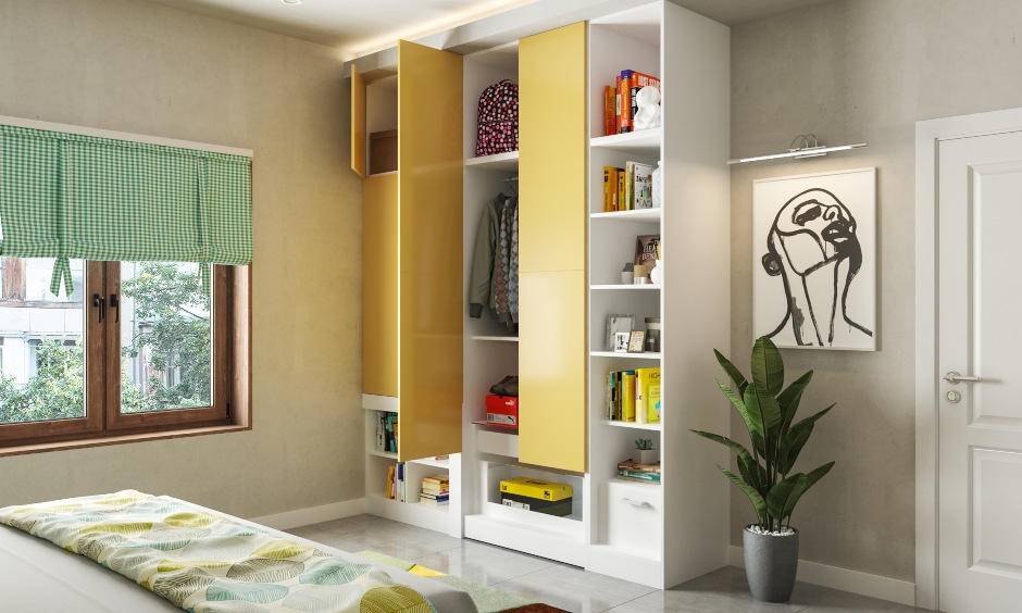Kids wardrobe design in yellow and white with pull out study table