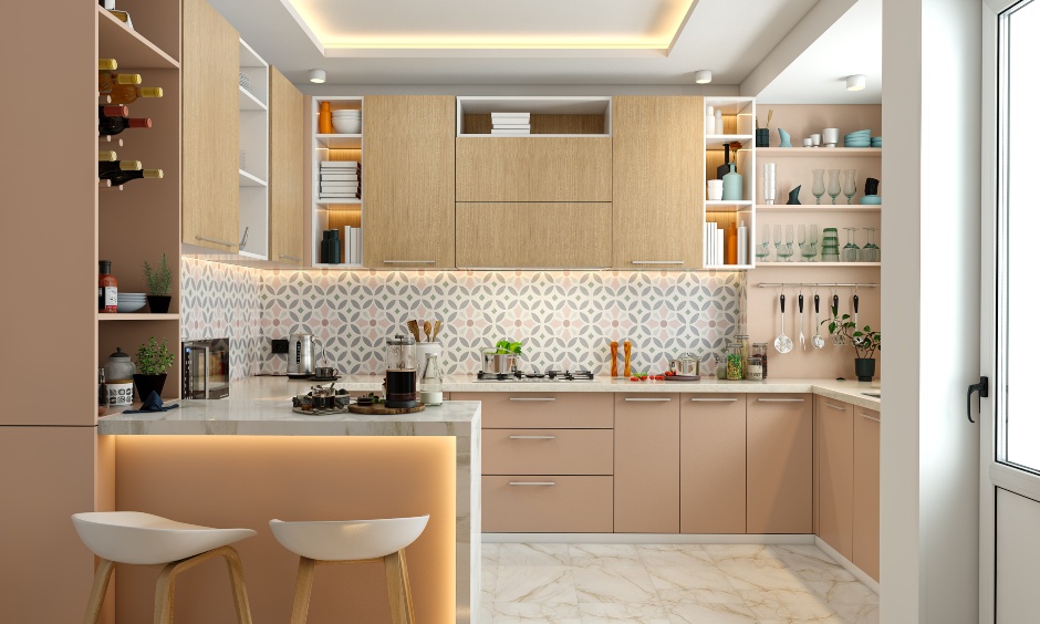 G shaped kitchen in pink with open wine rack and breakfast counter