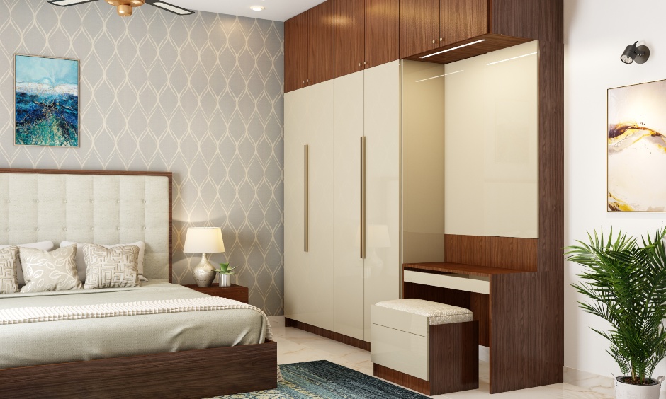 A stunning wardrobe finished in wood and ivory high gloss laminate with an attached dresser unit has a highly refined look