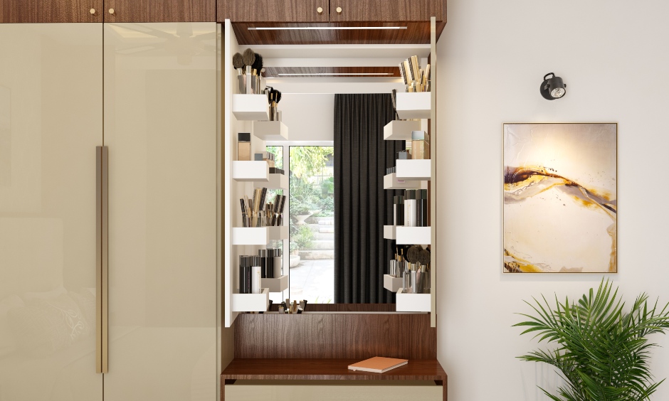 A wardrobe with a dressing table with a concealed mirror and drawers create a spacious look