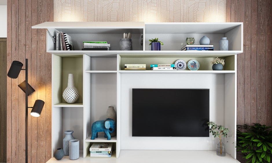 House interior design living room where the tv unit also has a shelf space to store a pouffe