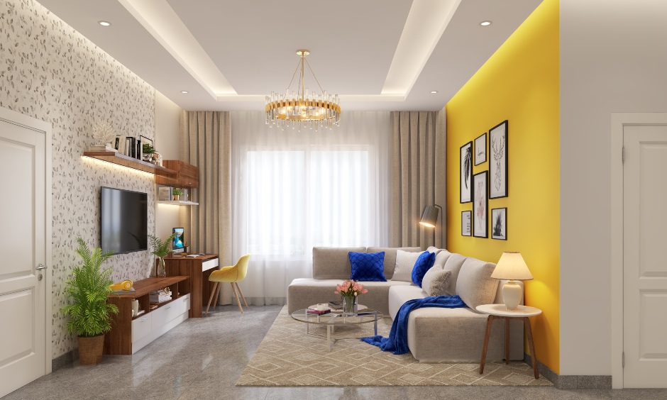 A small living room design with an L-shaped sofa and tv unit extends into a side table