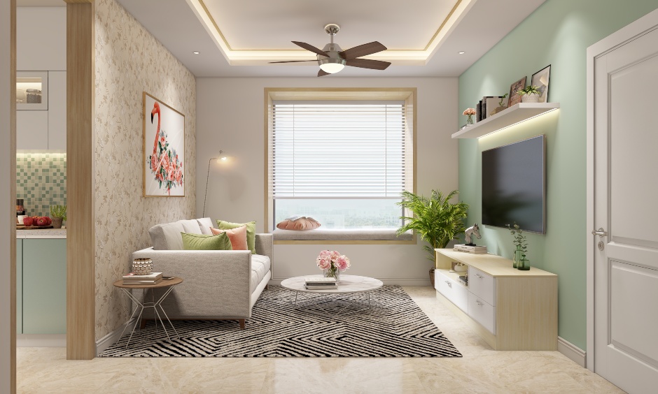 The tv unit design in the living room with floating wooden shelf and window seating complements the seating space
