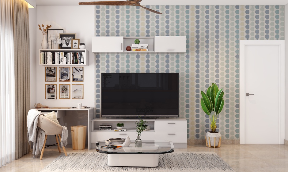 A Neutral Toned Living Room With TV Cum Study Unit - DesignCafe