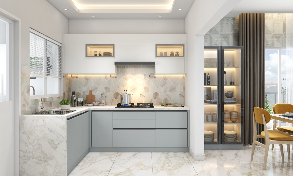 The L-shaped kitchen design in white and grey is compact yet has a luxurious appeal