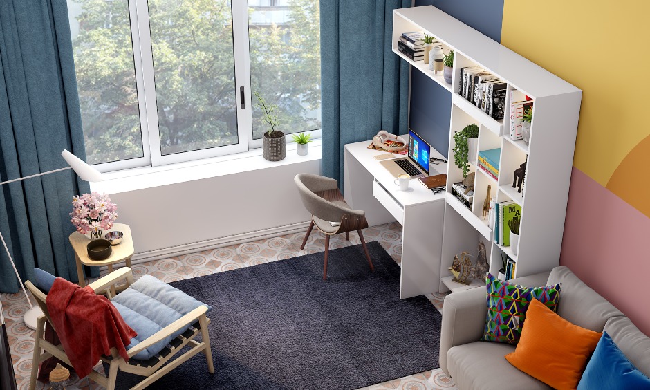 Study area in open living room with a book cabinet, study unit and chair