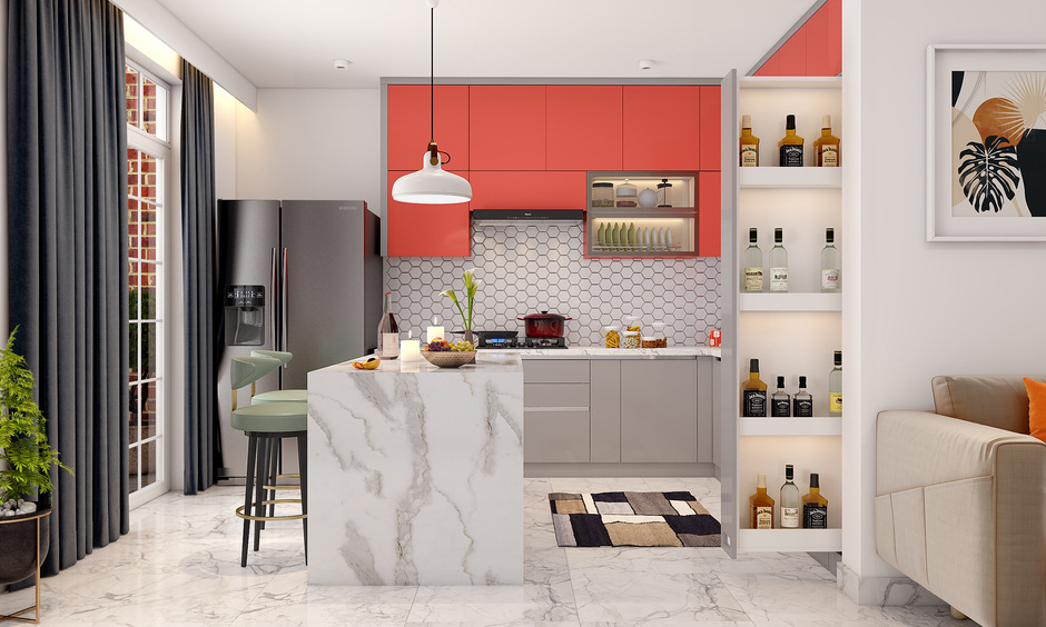marble island kitchen in red and white colour with bottle stand cabinet
