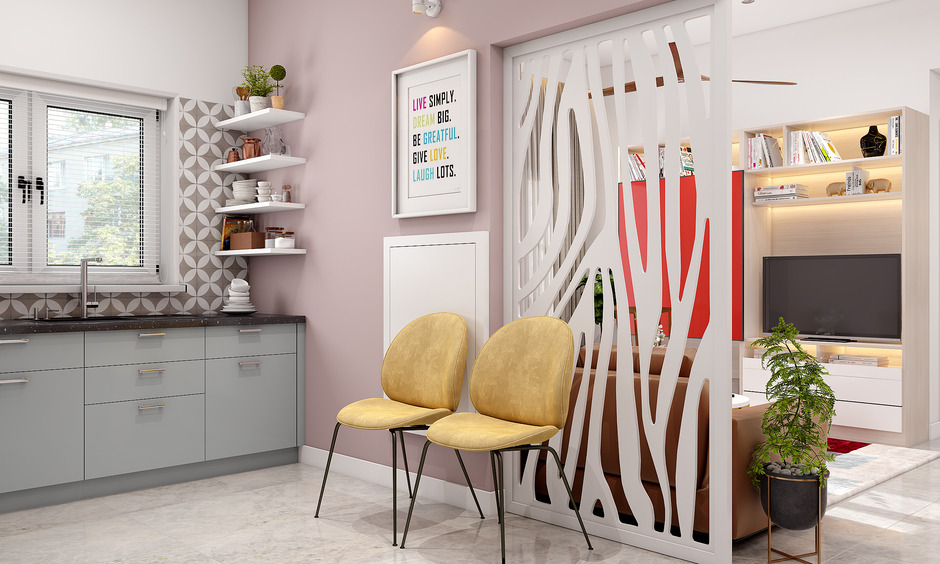 A L-shaped kitchen with wall-mounted foldable dining table, and can seat two people at a time.