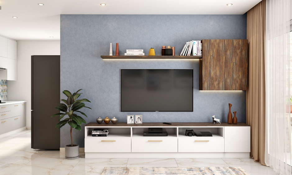 Compact living room design feature wall-mounted tv unit against blue wall