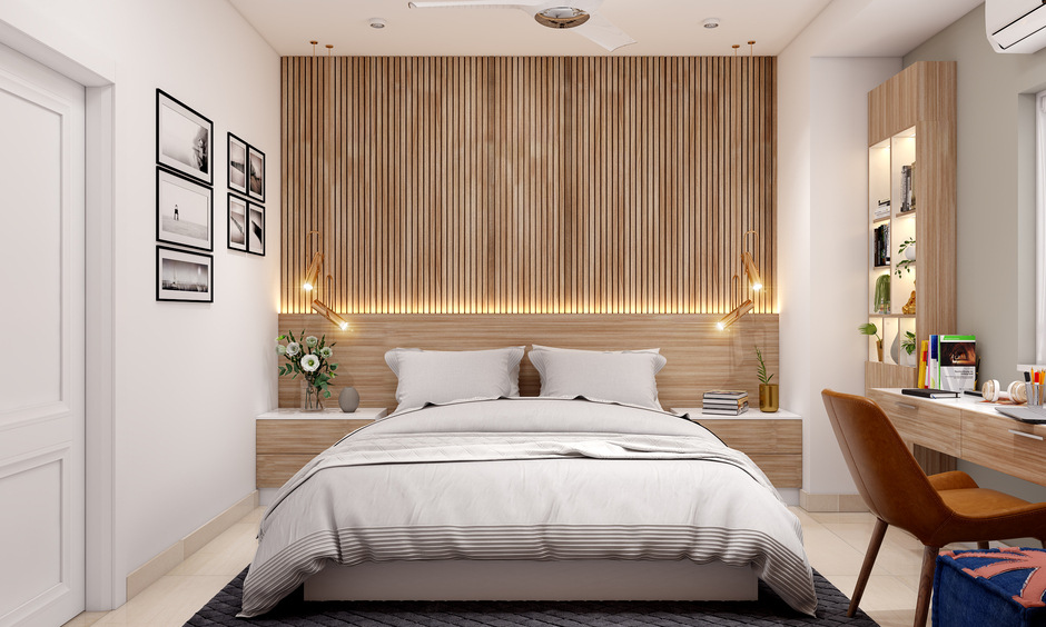 A Compact Bedroom With A Study Unit And A Hidden Dresser