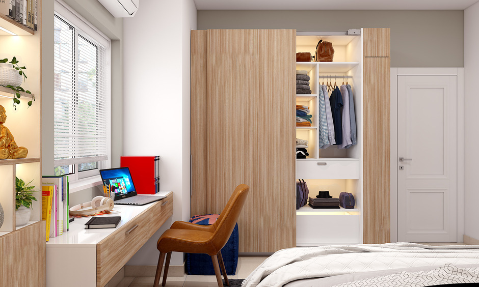 A Compact Bedroom With A Study Unit With a Opening Wardrobe