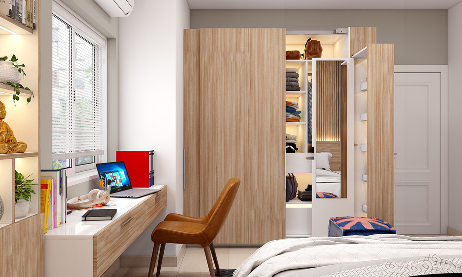 A Compact Bedroom With Opening Wardrobe And a Dresser