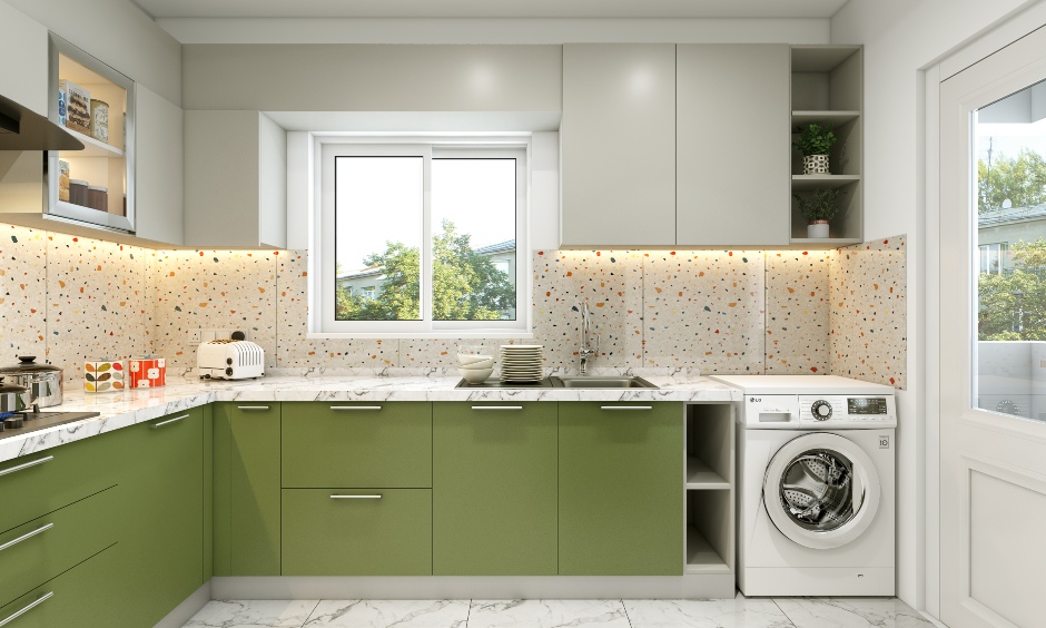 Green and grey l-shaped kitchen that extends into the laundry area