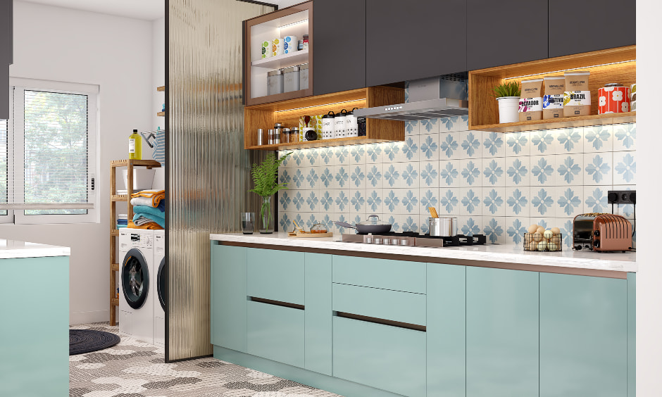 A parallel kitchen with an attached utility area separated by frosted glass partition