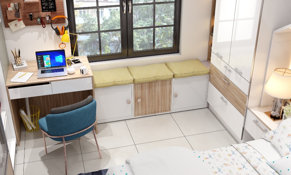 Kids bedroom with ergonomic study unit that extends into a window bay seat