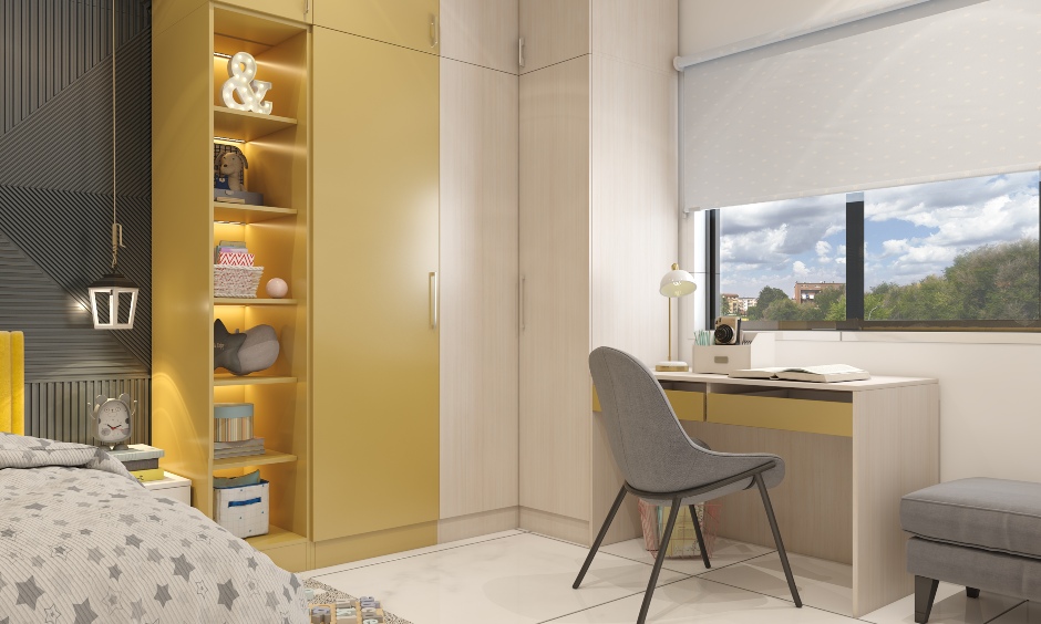 Space-inspired kids' bedroom wardrobe extends into a study unit featuring a desk with drawers and a comfortable chair