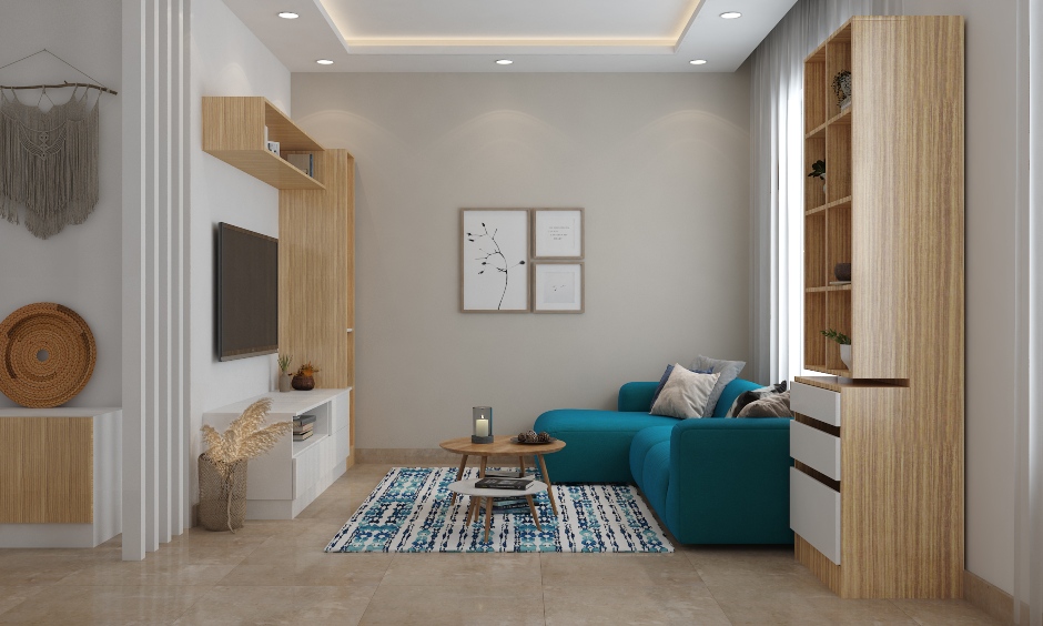 Minimalist living room is adorned in neutral colour and blue couch