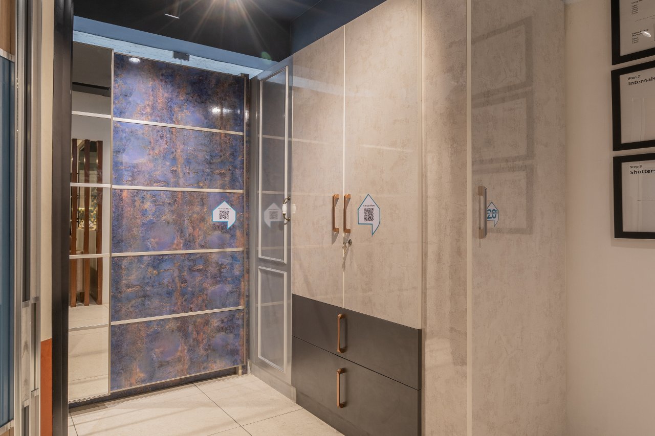 Glossy-finished wardrobe designed by DesignCafe, Coimbatore's top wardrobe designers