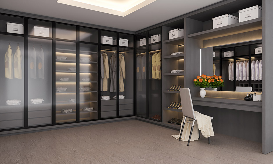 Matte black cupboard with frosted glass and sleek attached dressing table
