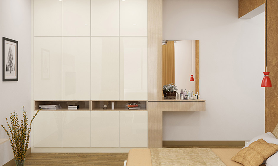 Green wardrobe with attached mirror and functional dressing unit
