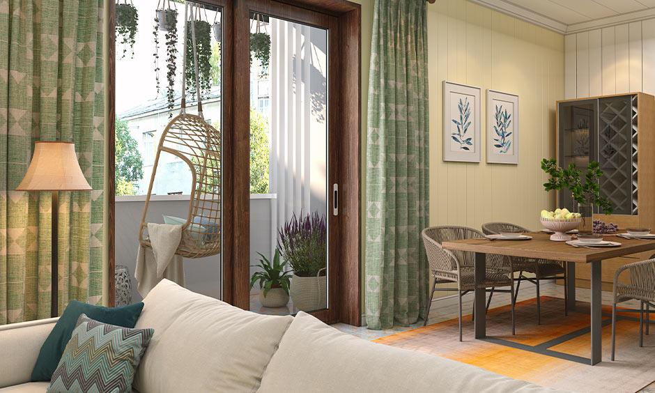 A cosy sitting area with cottage decor, including floral pillows, vintage mirrors, and soft lampshades.