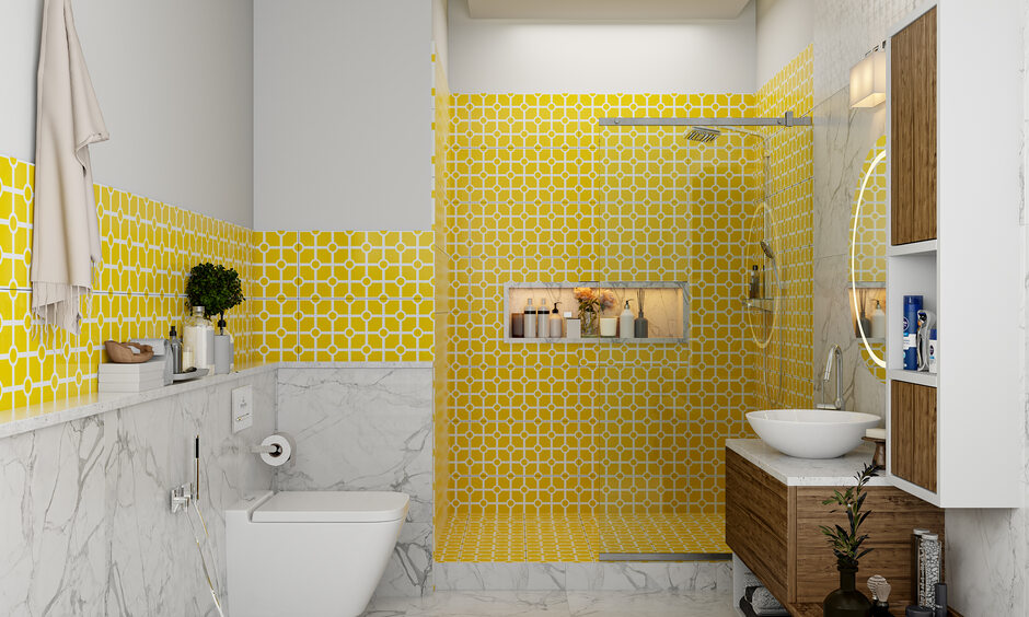 Latest bathroom designs with glass partition, yellow patterned tiles and marble tiles on the floor and walls.