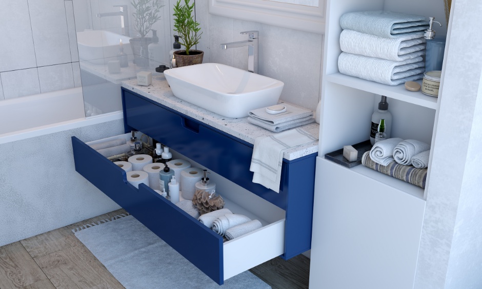 Simple bathroom designs with striking blue vanity, tall unit storage, and Edison bulb lights.