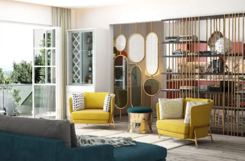 A modern Indian living room features a wooden room divider with brass accents and contemporary seating.
