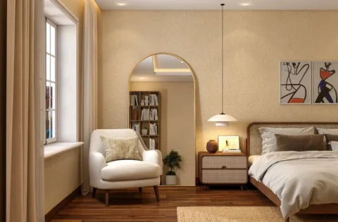 A finished 2BHK bedroom with a bed, bedside tables and built-in storage.