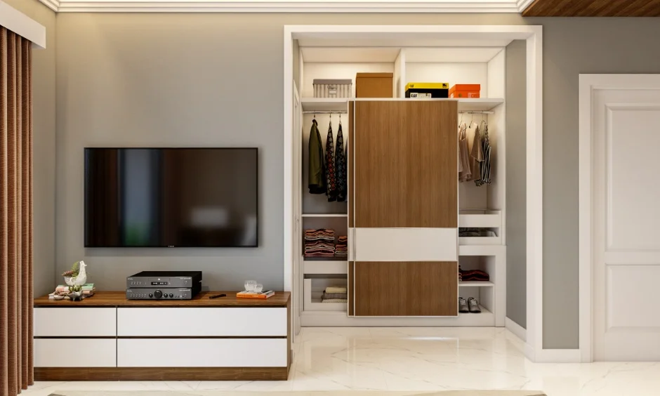 A furnished 2BHK living area includes a TV unit, storage and built-in cabinetry. 