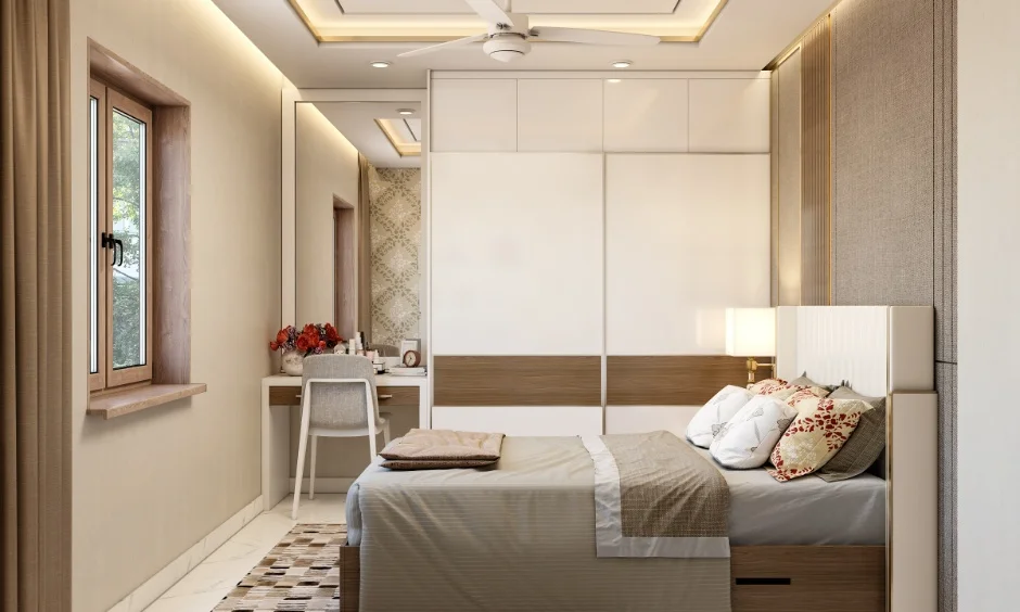 2BHK bedroom interior design with sliding wardrobe, false ceiling lighting, and dressing table to save on budget