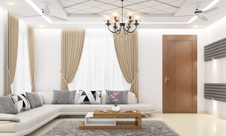 White layered ceiling design creates depth and elegance in a contemporary living room