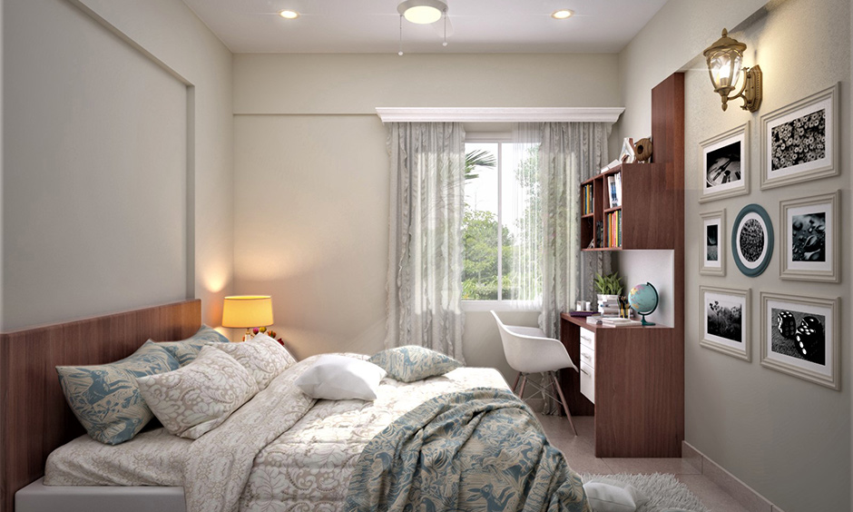 A bedroom decorated with accent lighting and photo frames on the wall is perfect elegant home decor.