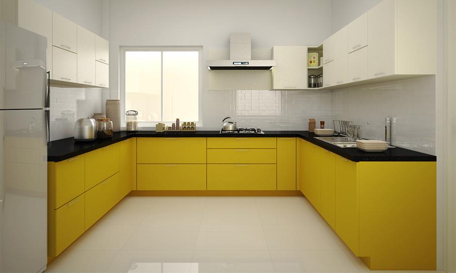 C-shaped kitchen idea with matte cabinets, ambient lighting, and monochrome tones for a sleek, modern interior.