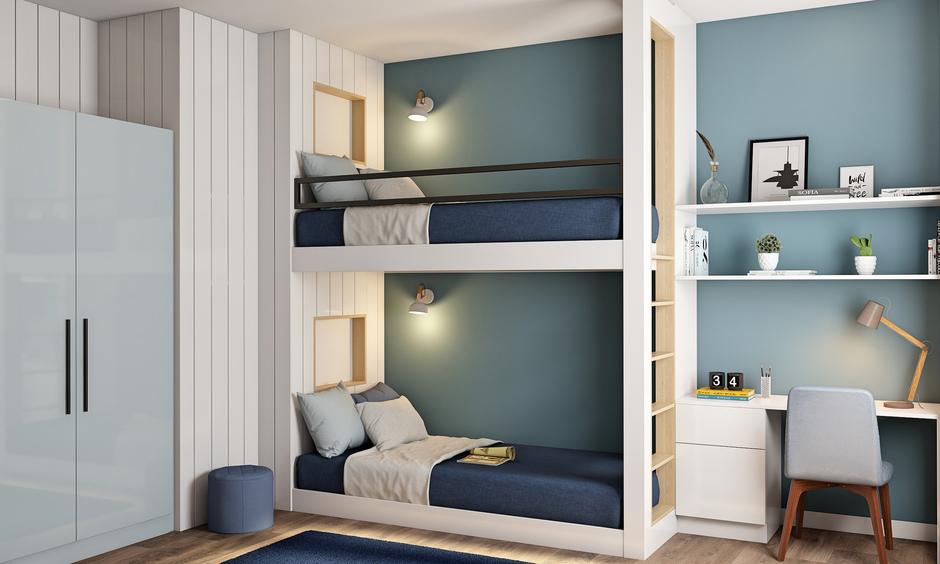 Twin-over-twin bunk bed in navy and teal theme for a calm, shared boys’ room with study space