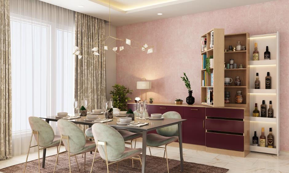 Dining room with blush wall and pastel chairs.