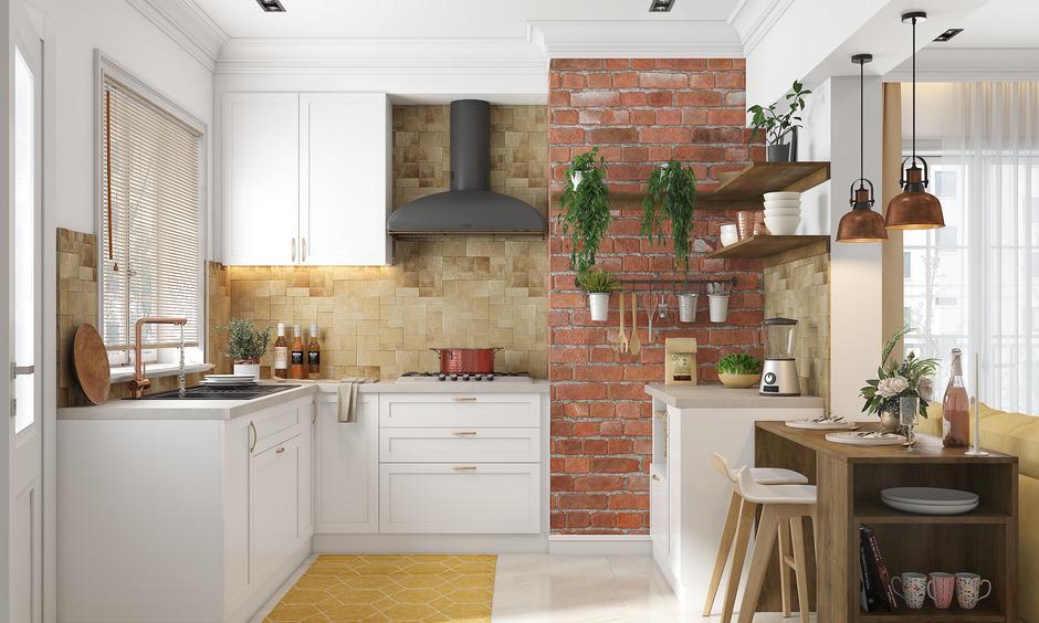 White rustic kitchen with brick wall, jali seating, and wooden breakfast table.