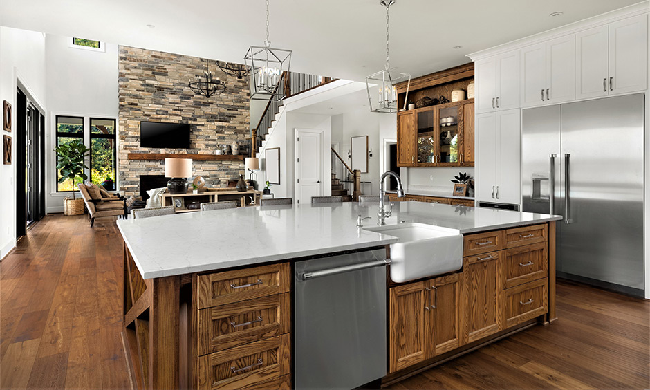 Rustic kitchen with matte cabinets and built-in black chimney and appliances.