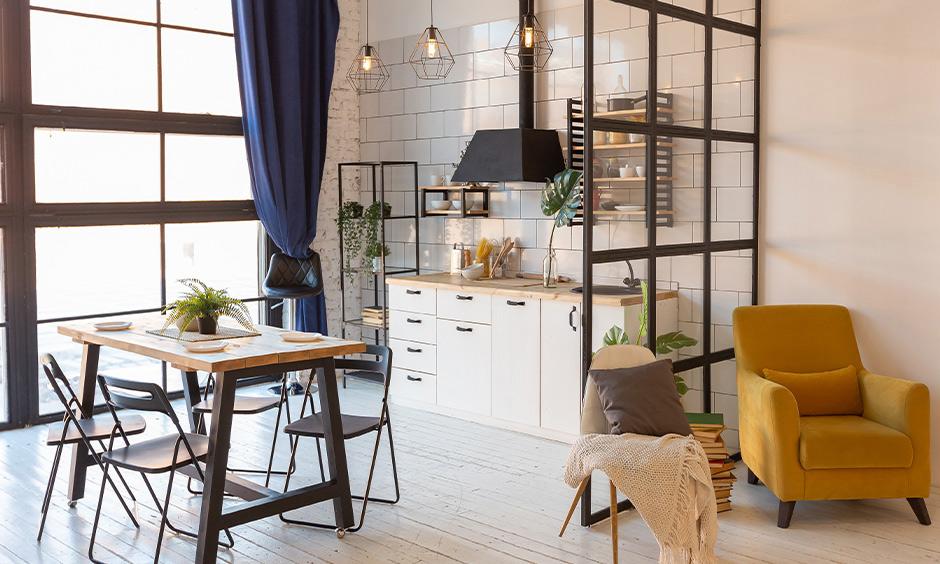 Light wood kitchen with white cabinets, jute textures, and open airy shelving.