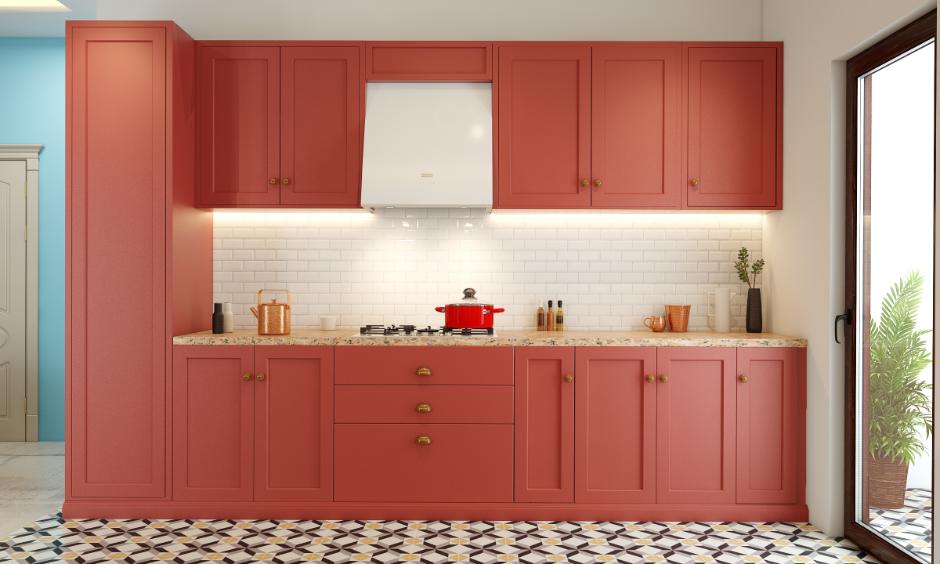 Modular style kitchen with red cabinets, granite counter and sleek overhead storage