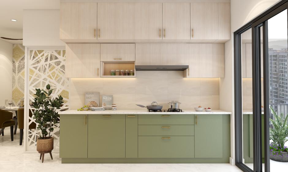 Simple normal kitchen design for Indian homes featuring quartz countertop, sage green base units and light wood laminate cabinets