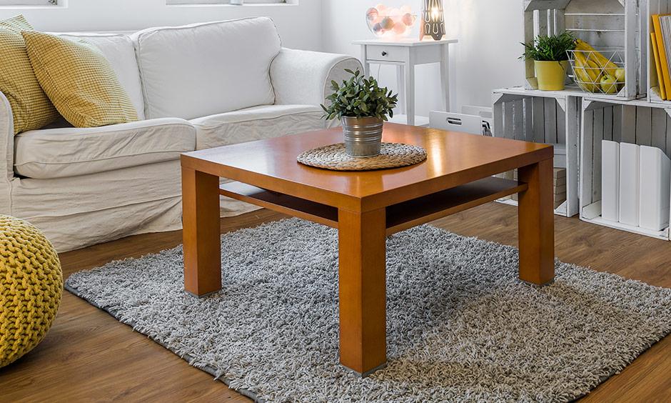 Square coffee table for the living room to add structure to the space