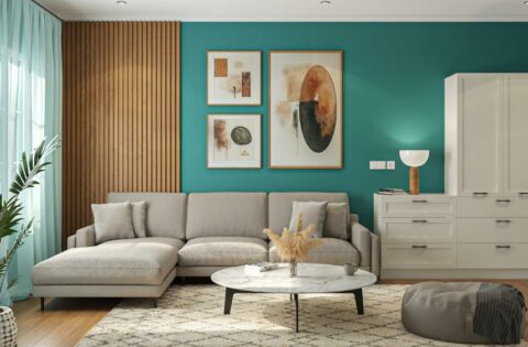Living room with teal wall colour design, wooden panel, and beige sofa for a stylish home wall colour design