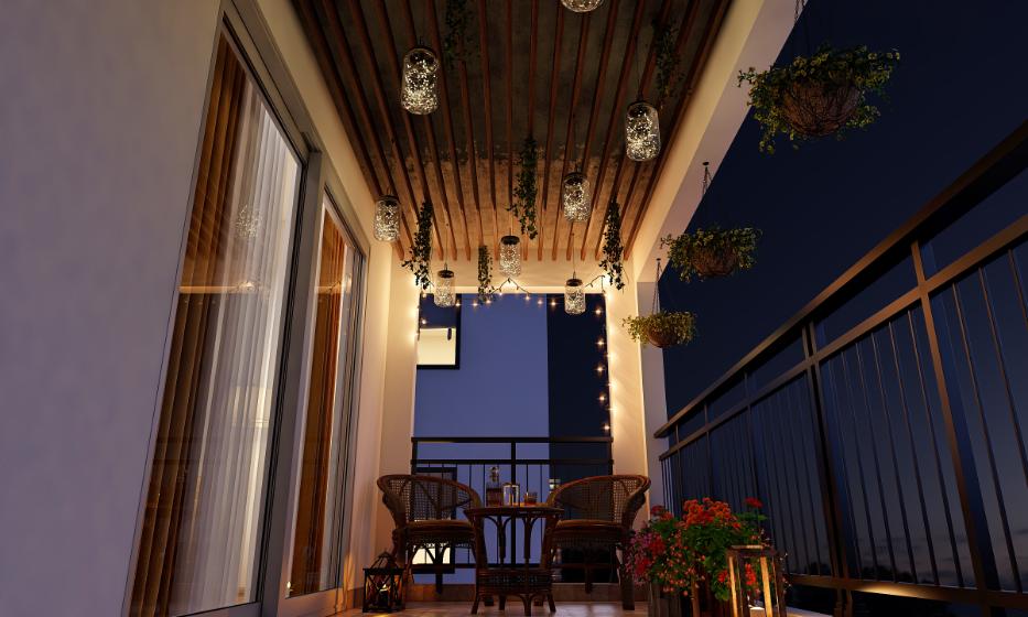 Night view of balcony with iron railing, hanging lights and garden chairs