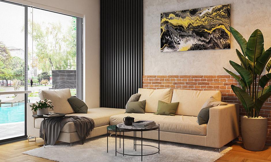 Earthy-toned living room with black accents and rustic Indian-style decor