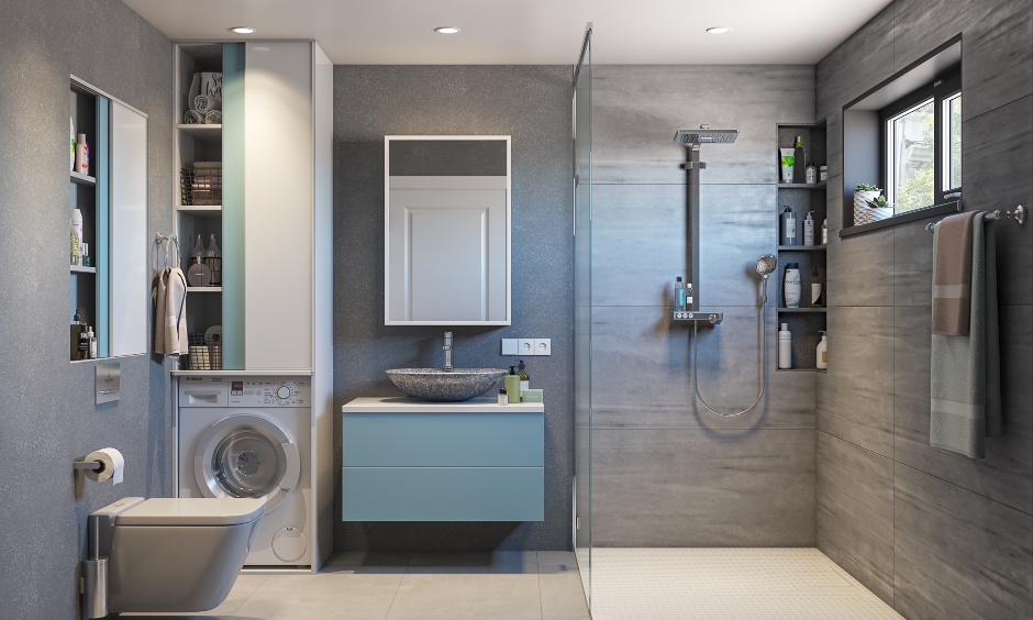 Grey and white bathroom interior featuring tall unit with washing machine space and shower cubicle.