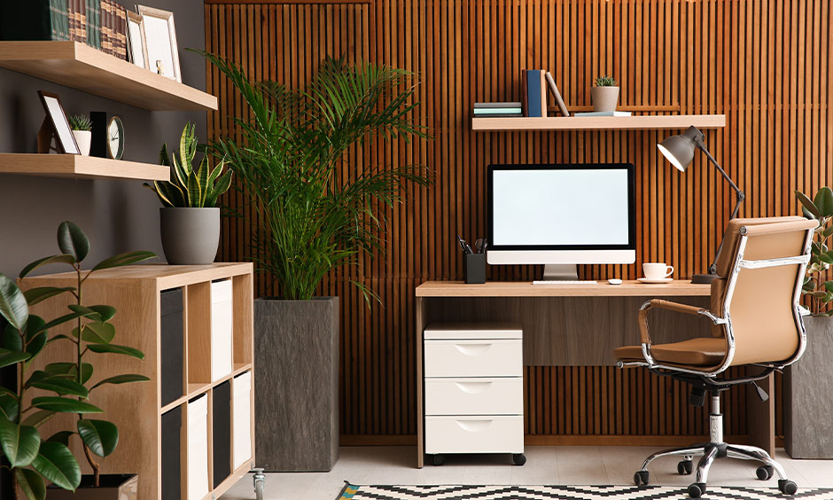 Fabric louvres with thick cloth layers installed on walls for soundproofing a home office.
